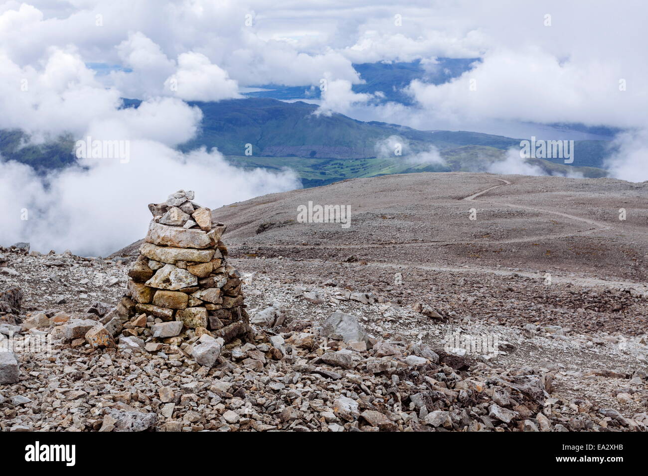 A pile of stones made by hikers and climbers along the Mountain Track (Tourist Route), Ben Nevis, Highlands, Scotland, UK Stock Photo