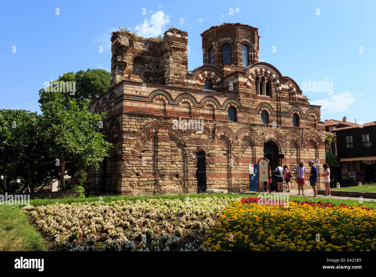 Flower border and visitors, Church of Christ Pantokrator, Nesebar (Nessebar), UNESCO Site, Black Sea Coast, Bulgaria Stock Photo