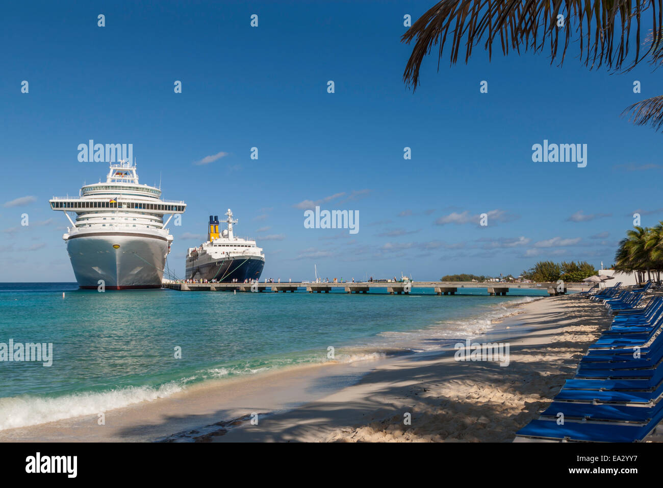 Cruise ships and disembarking passengers, seen from the cruise terminal beach, Grand Turk, Turks and Caicos, West Indies Stock Photo
