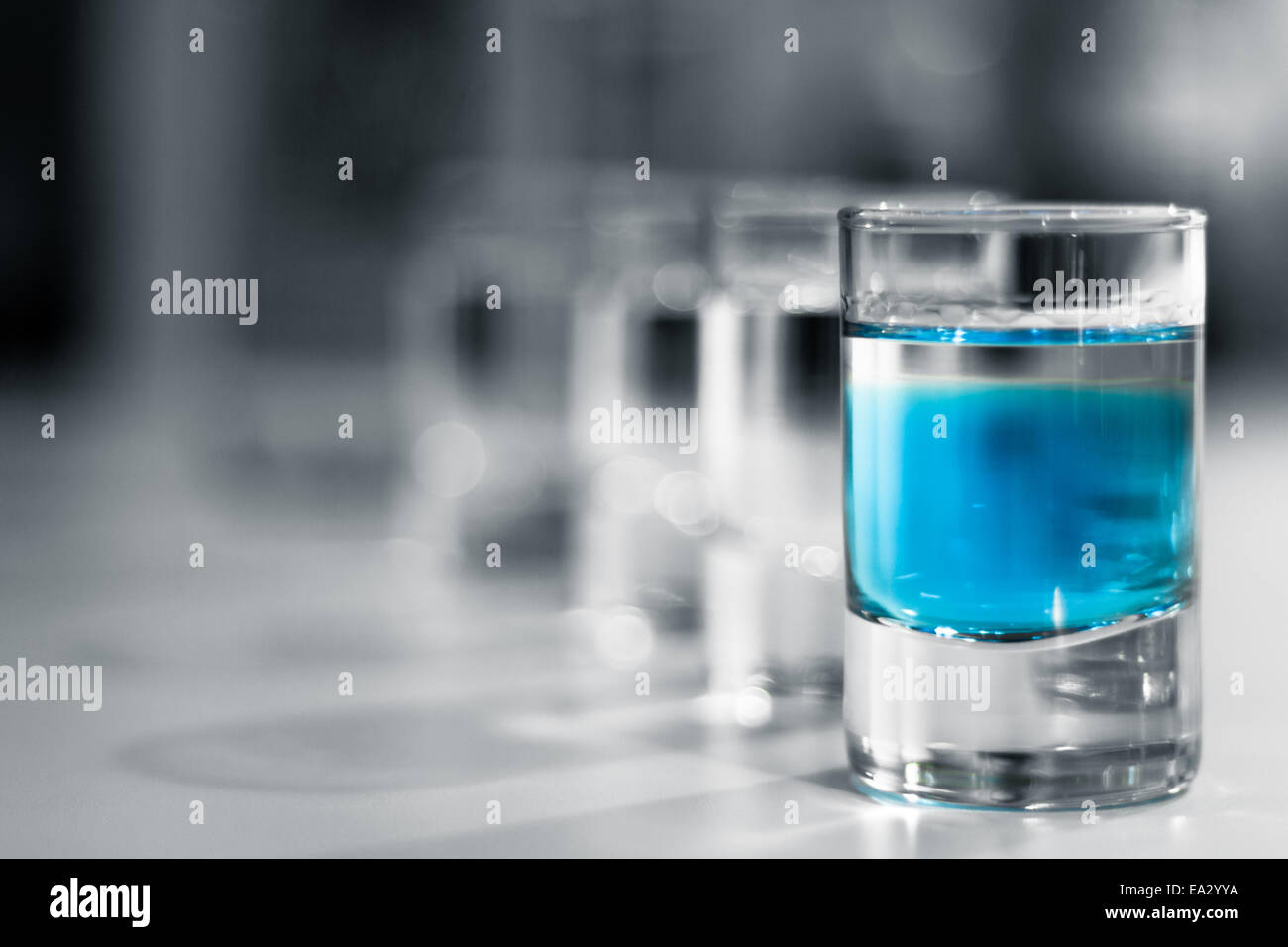 Shot Glasses with Blue Alcohol Stock Photo