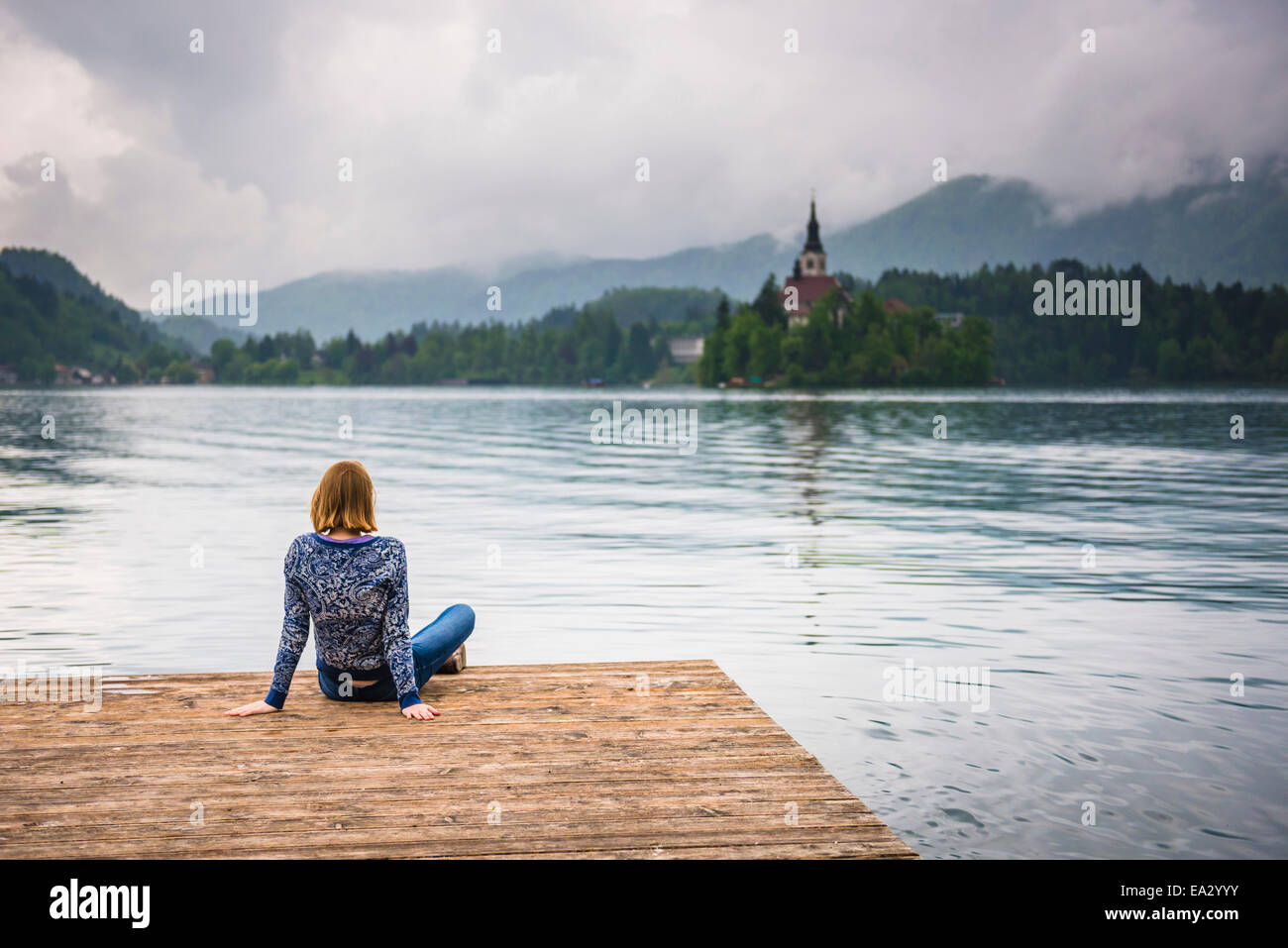 Woman looking at view, Lake Bled, Julian Alps, Gorenjska, Slovenia, Europe Stock Photo
