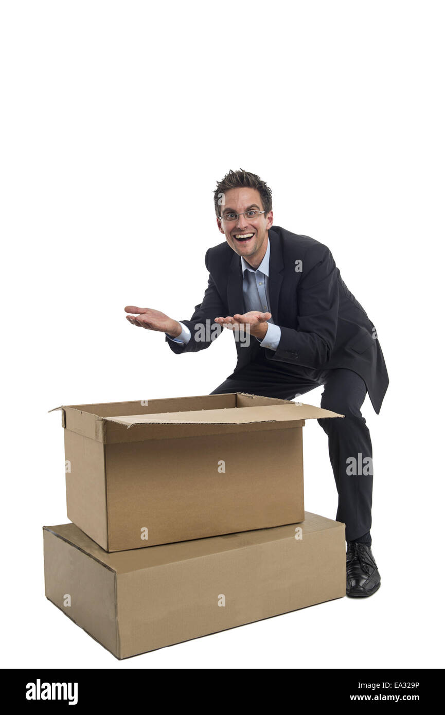 Businessman in front of a box Stock Photo