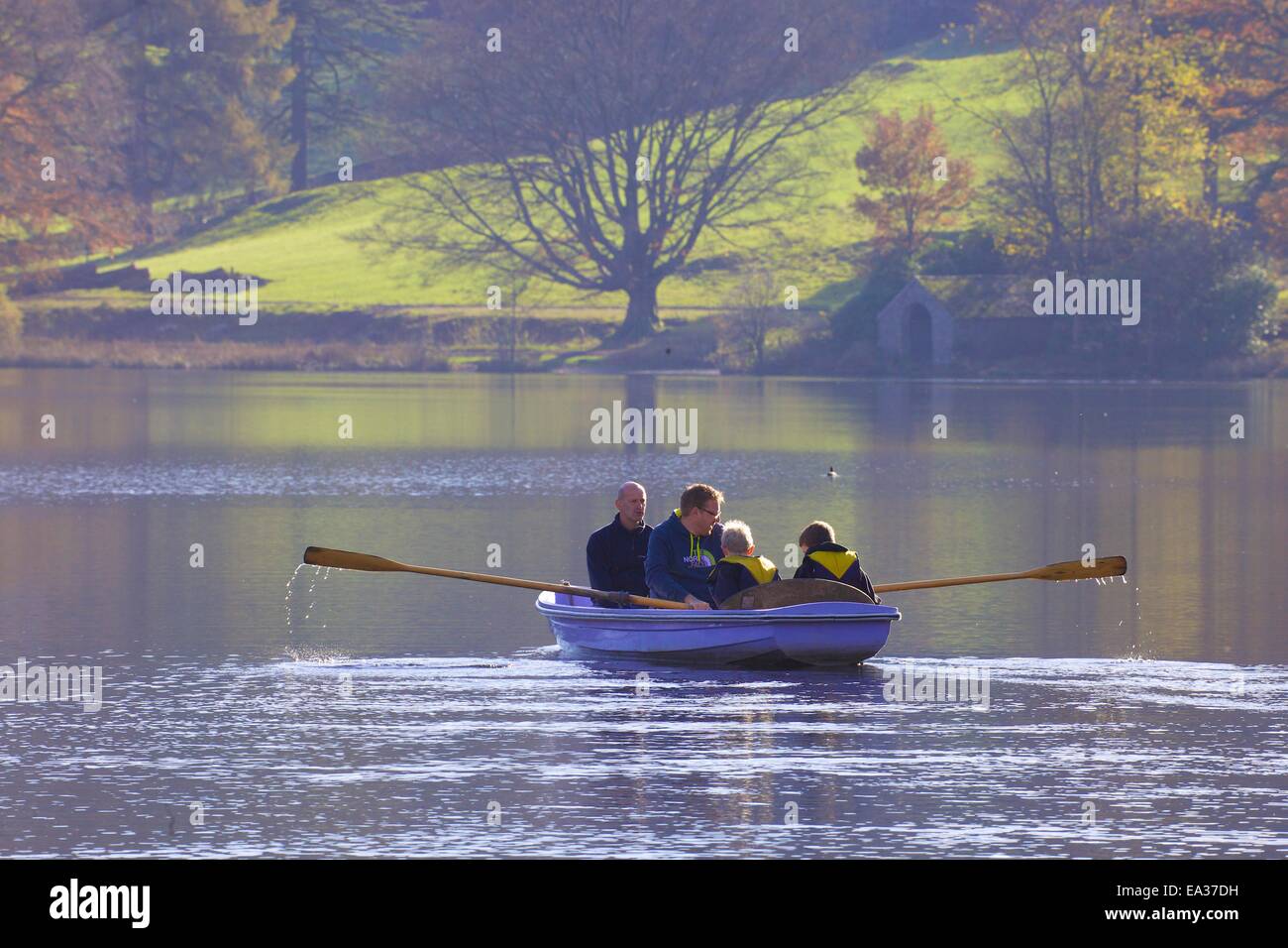 Family boating on Grasmere, Lake District National Park, Cumbria, England, UK. Stock Photo