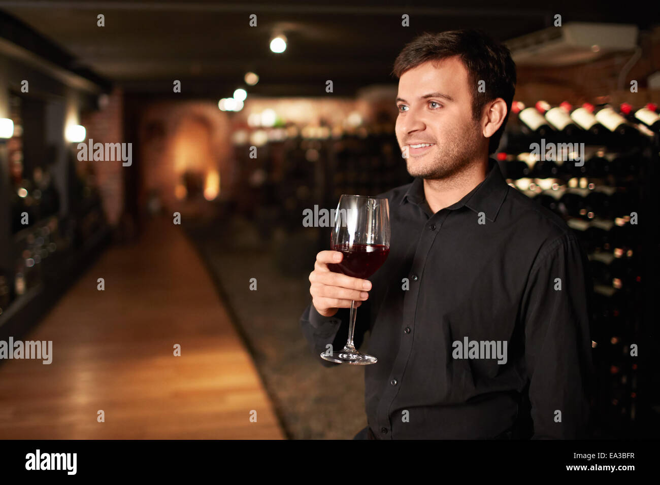 Man with a glass of wine Stock Photo - Alamy