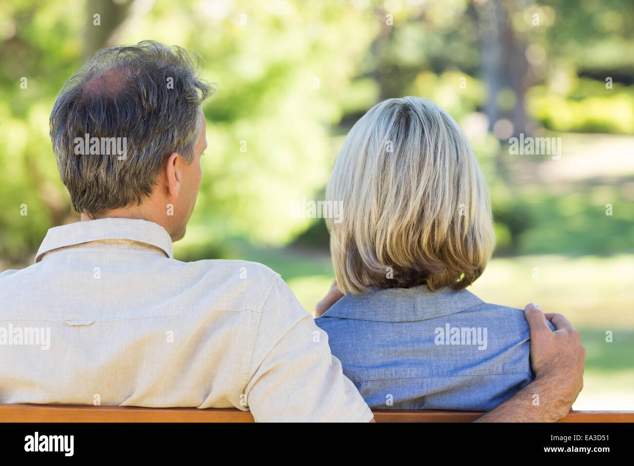Couple relaxing in park Stock Photo - Alamy