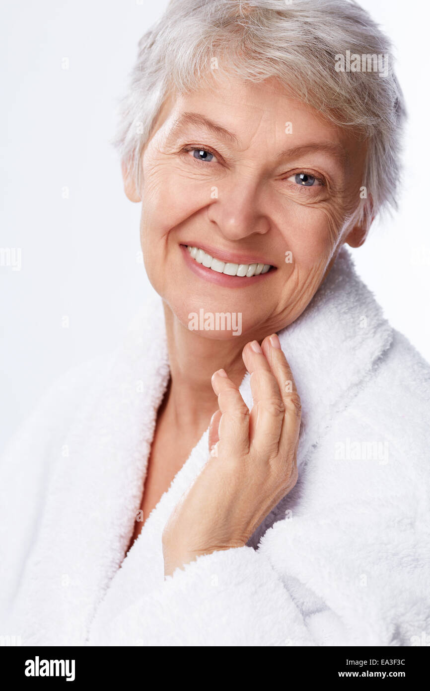 Woman touching face happy hi-res stock photography and images - Alamy