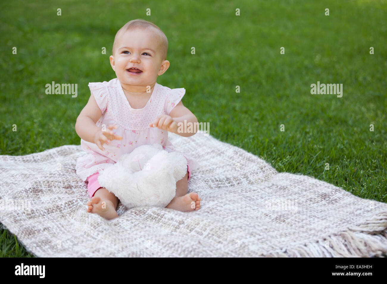 Cute Baby Sitting Between Green Blanket Stock Photo Phakimata 3126524