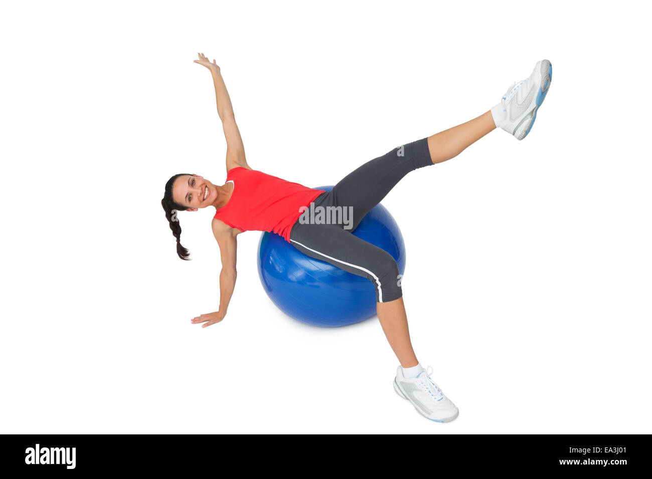 Fit young woman stretching on exercise ball Stock Photo - Alamy