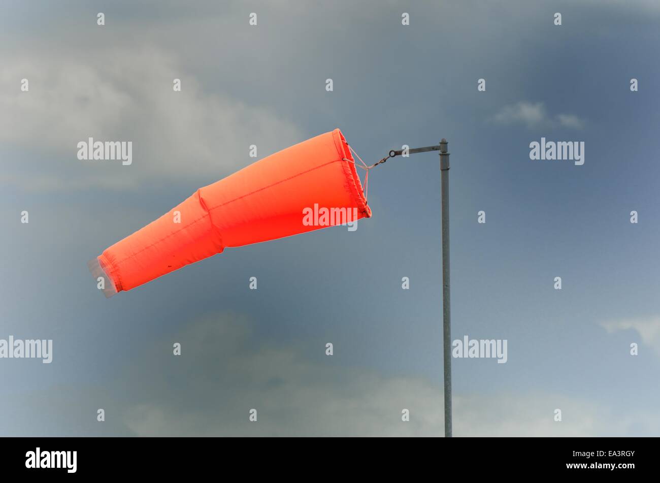 wind sock with cloud background Stock Photo - Alamy