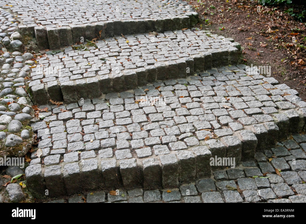 Granite sett steps, part of the path leading to the John F Kennedy Memorial at Runnymede, UK. Stock Photo
