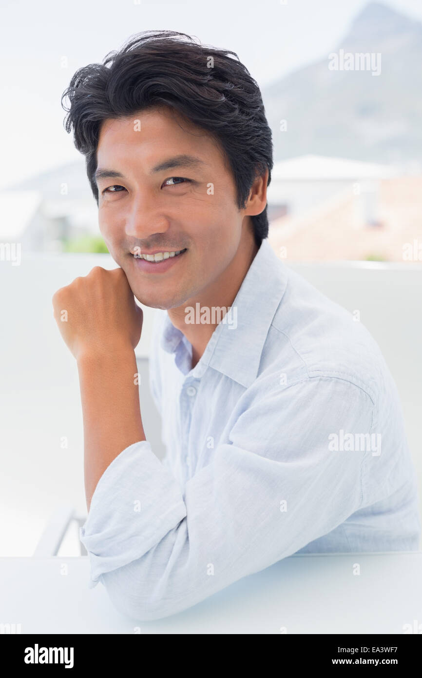 Happy man smiling at camera Stock Photo - Alamy