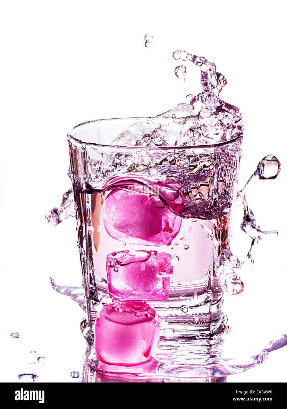 Water splash with pink ice cubes Stock Photo
