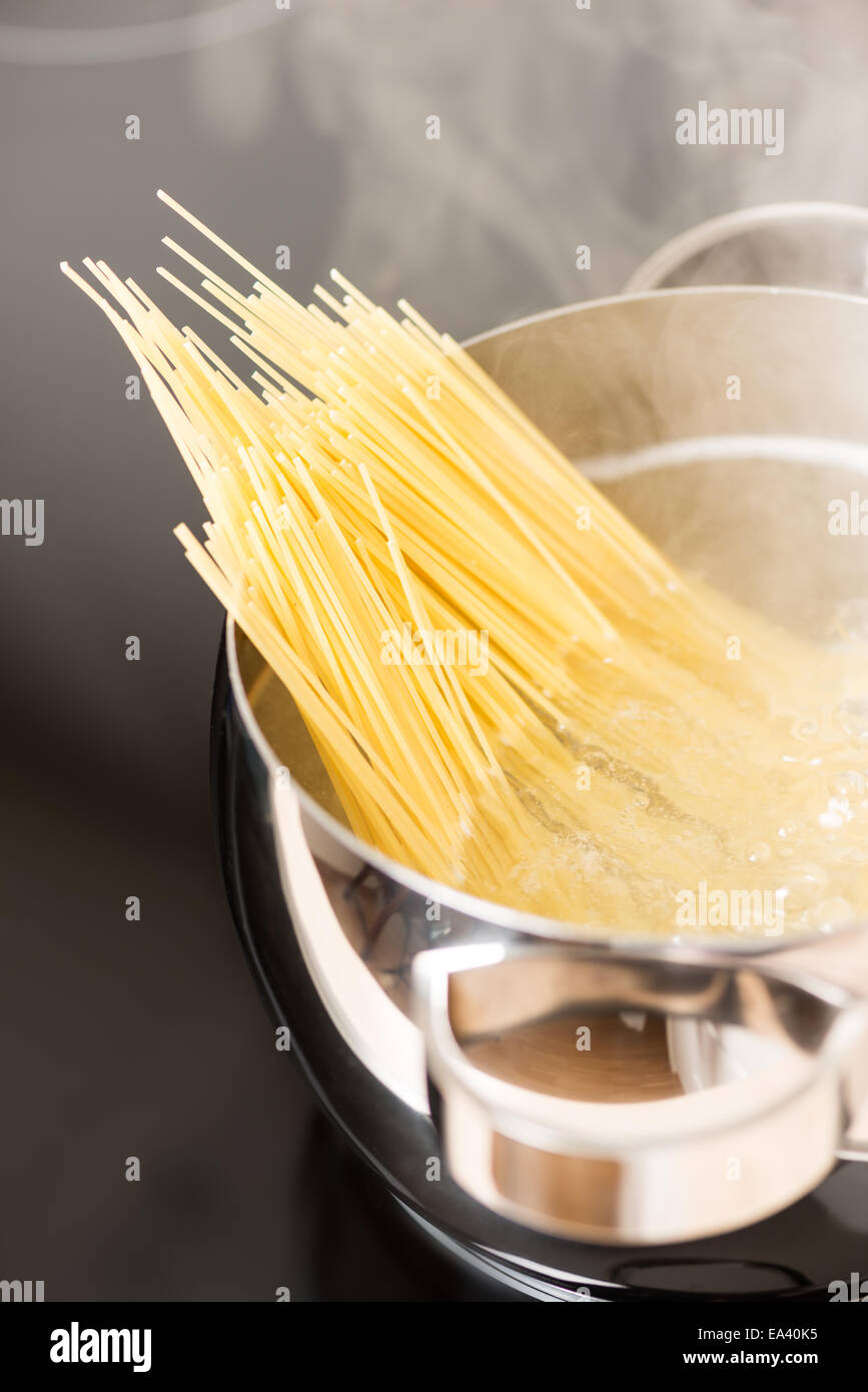 Pan with spaghetti cooking steamin Stock Photo