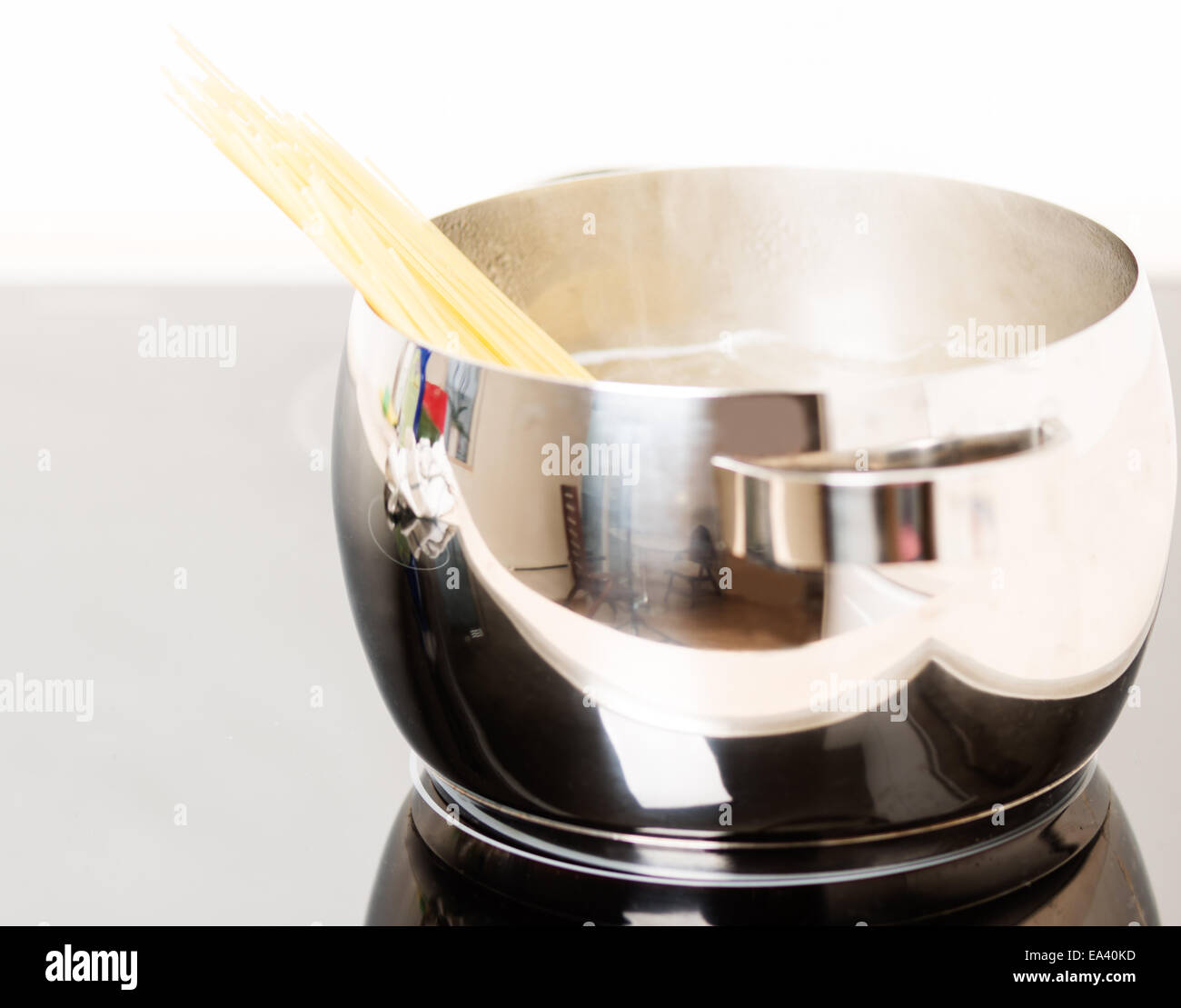 Pan with spaghetti cooking Stock Photo