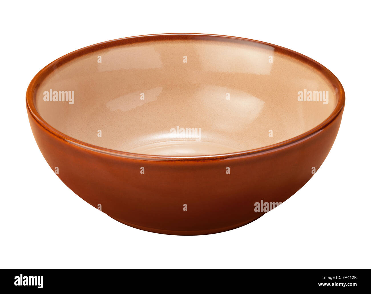 Empty brown ceramic bowl with a beige center. The subject is isolated on white. Stock Photo