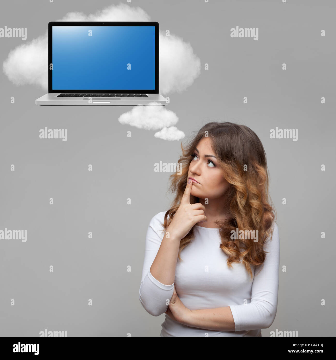Thinking woman and laptop on cloud Stock Photo