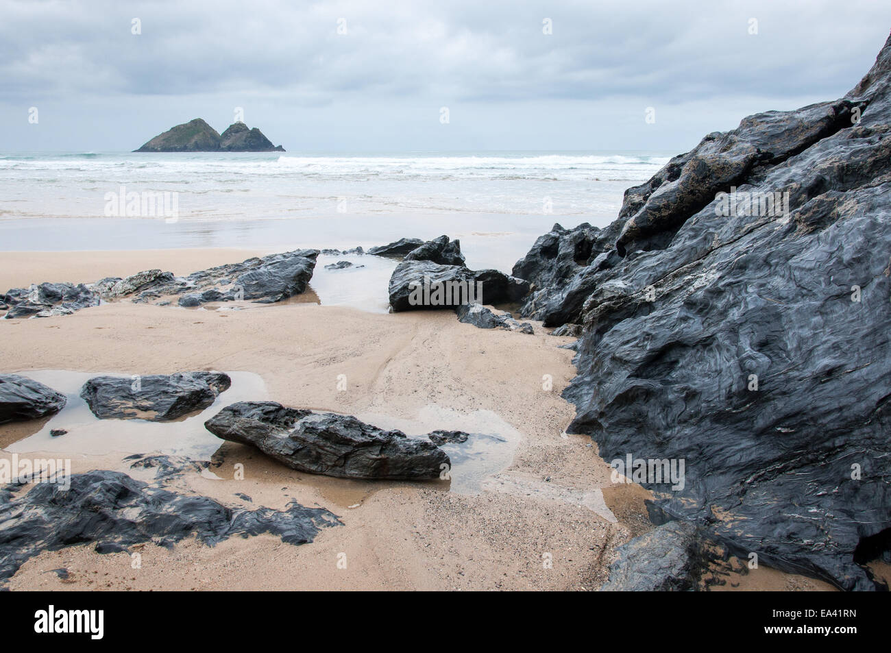 View to Gull rocks from the beach at Holywell Bay. Stock Photo