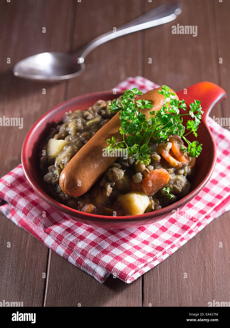 Lentil soup with sausages in a bowl Stock Photo