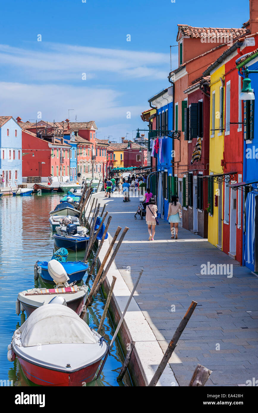 Vertical view of colorful street with canal in Burano, near Venice, Italy Stock Photo