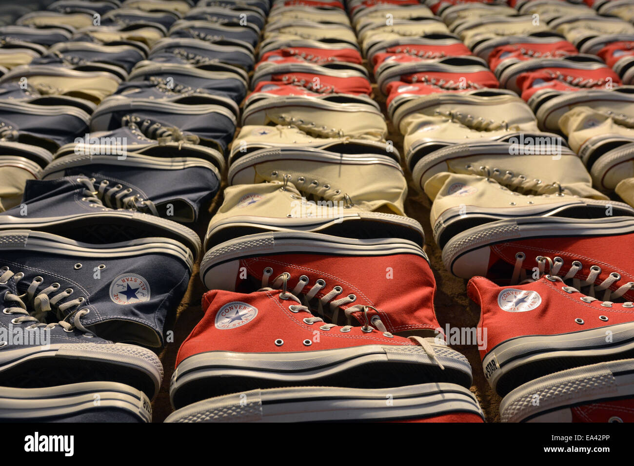 Converse sneakers laid out in the pattern of an American flag at the Converse  store on Broadway in Greenwich Village, New York City Stock Photo - Alamy