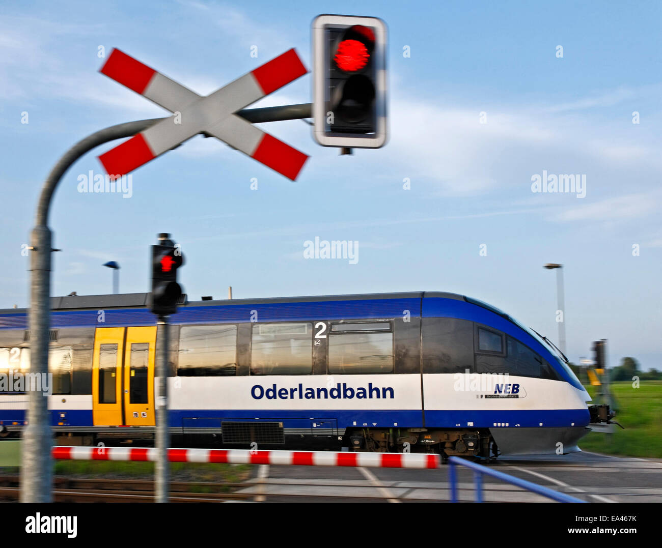 Oderlandbahn train crossing a railway-crossing, Brandenburg, Germany Stock Photo