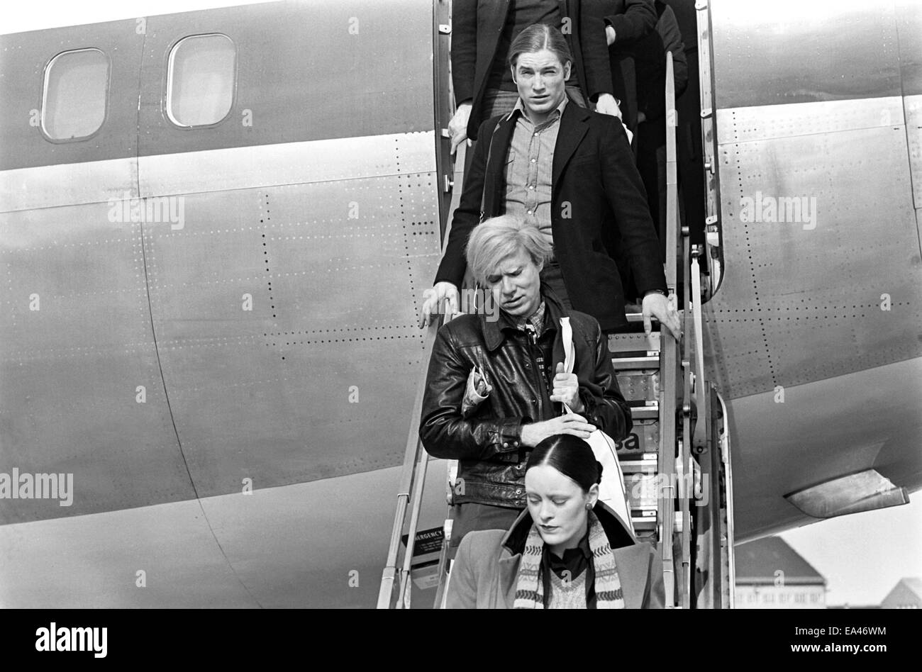 (File) Andy Warhol (middle), Jane Forth and Joe Dallesandro arrive for the premiere of Warhol's latest film 'Trash' in Munich on 17.02.1971. Stock Photo