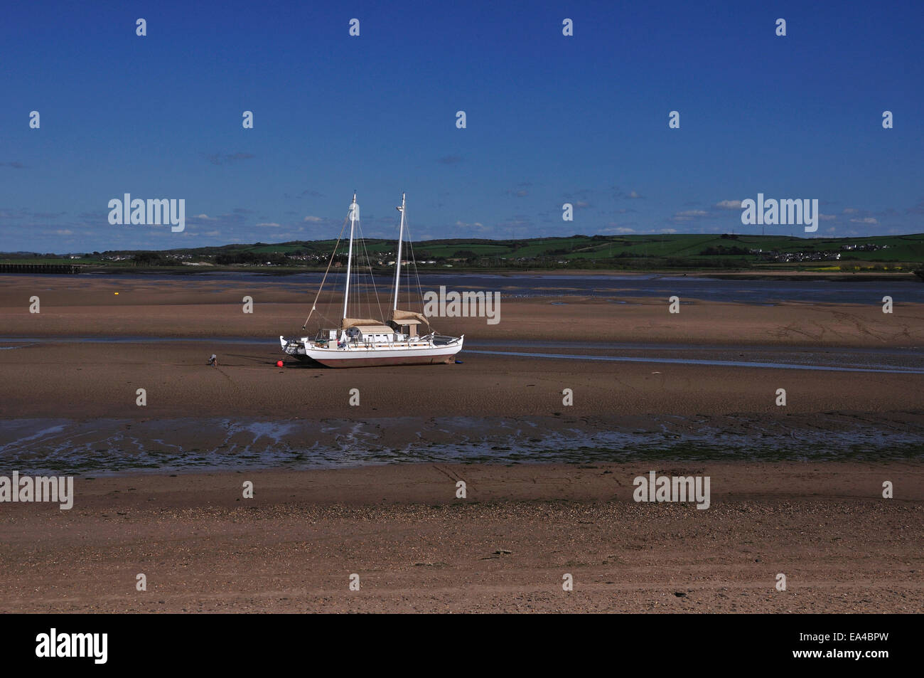 A single yacht on the Torridge estuary at low tide UK Stock Photo