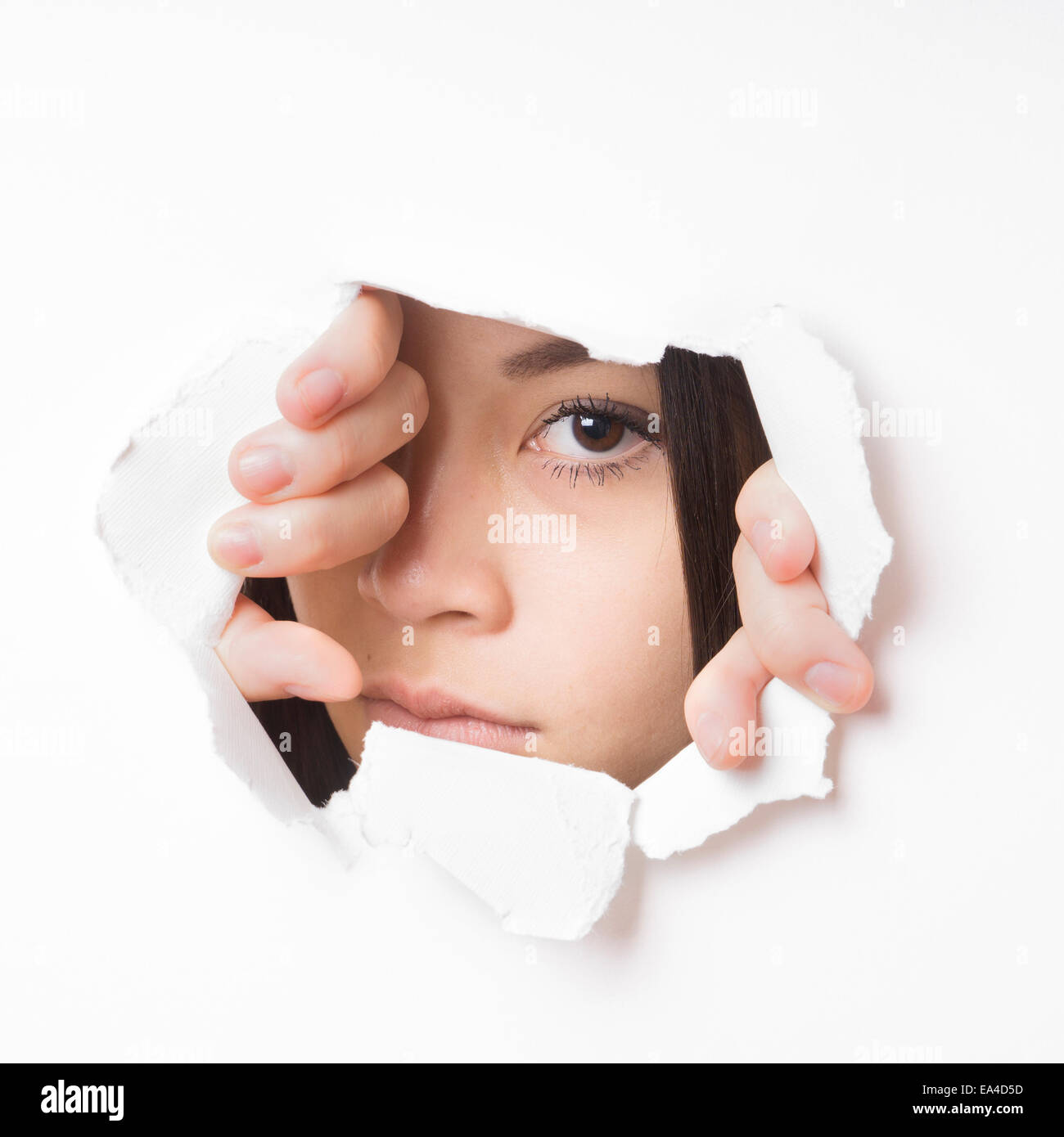 young asian woman peeking Stock Photo