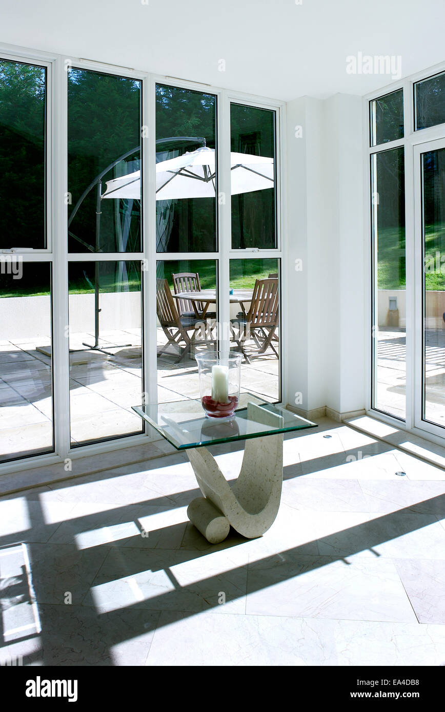 Corner window, detail with view of patio in Moonraker house, Exmouth