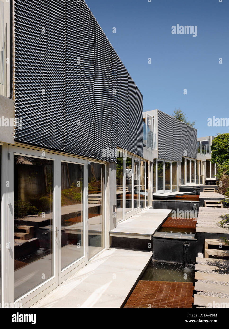 Water feature and exterior facade of Jacksons Ope, Eco house, Truro