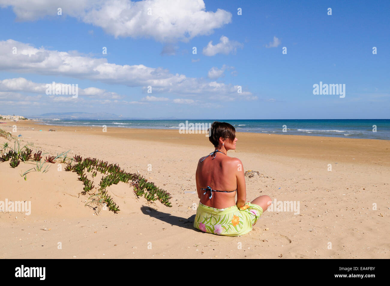 one girl on the beach of Tre Fontane, Sicily Stock Photo