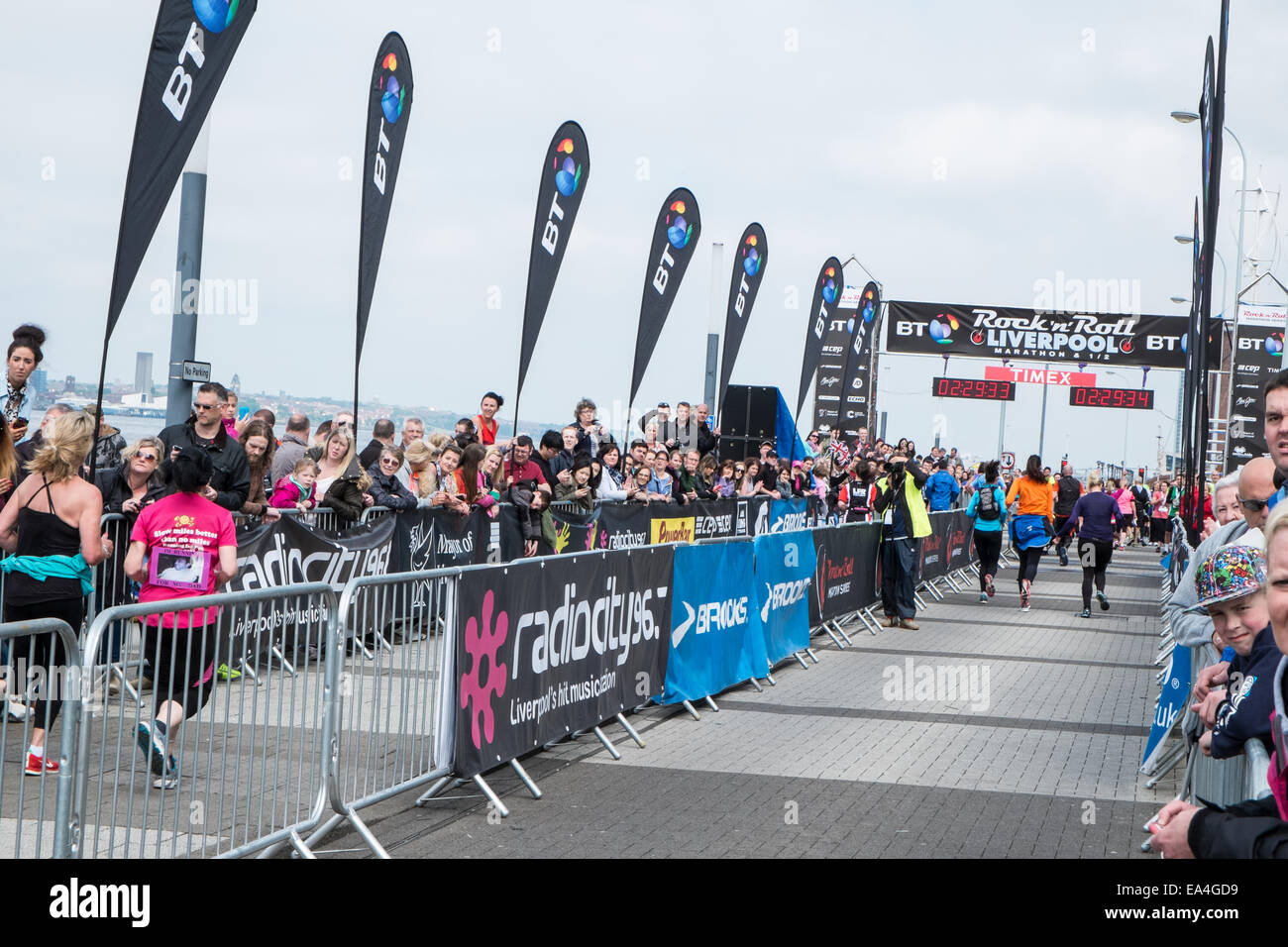 At the end, finish line, of Liverpool Rock n Roll Marathon at river side,Mersey, next to Liverpool Echo Arena and Big Ferris Wheel,Liverpool,England, Stock Photo