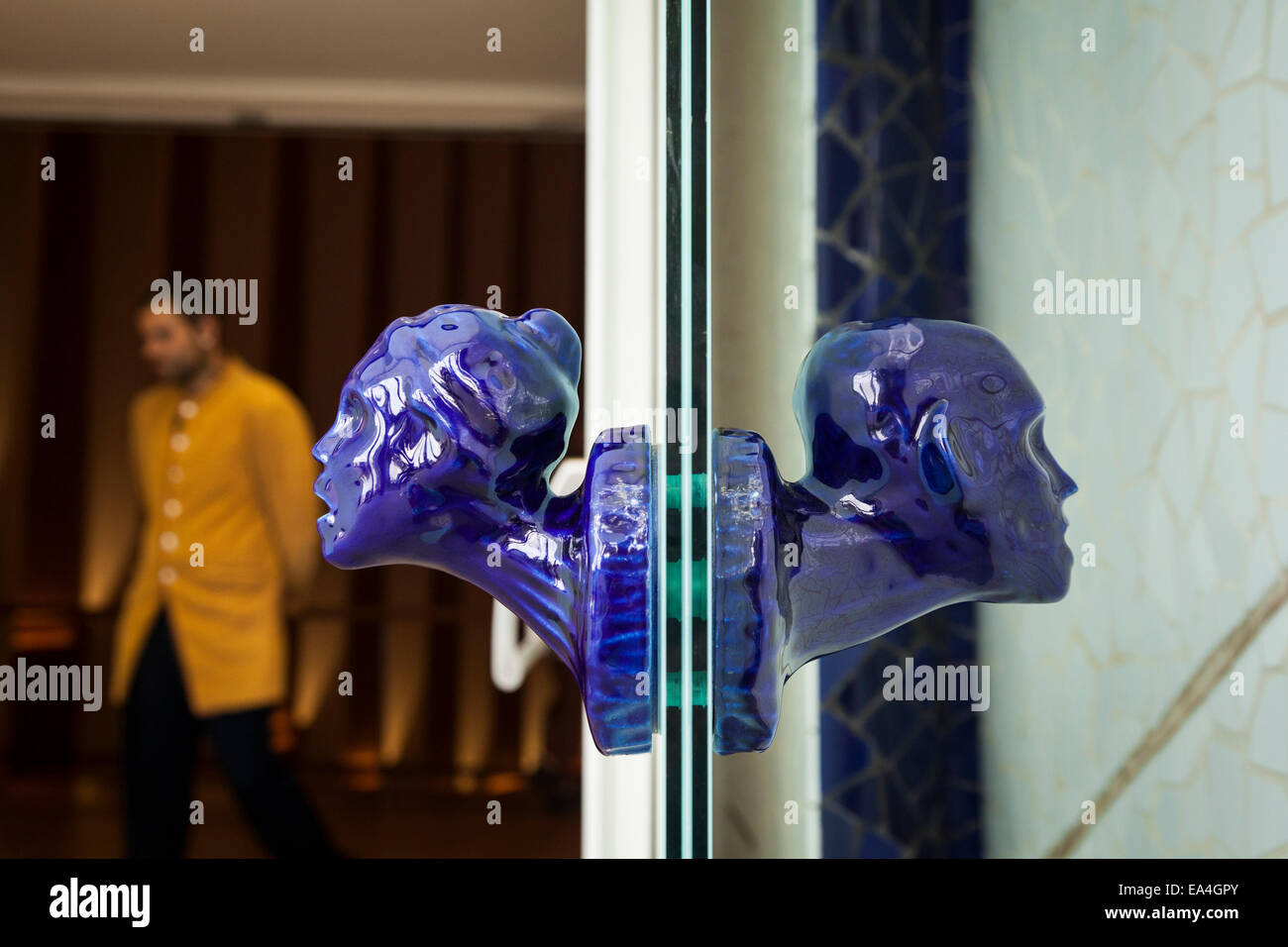 Blue glass heads as door knobs in the palacio de las artes in the city of arts and science, Valencia, Spain. Stock Photo