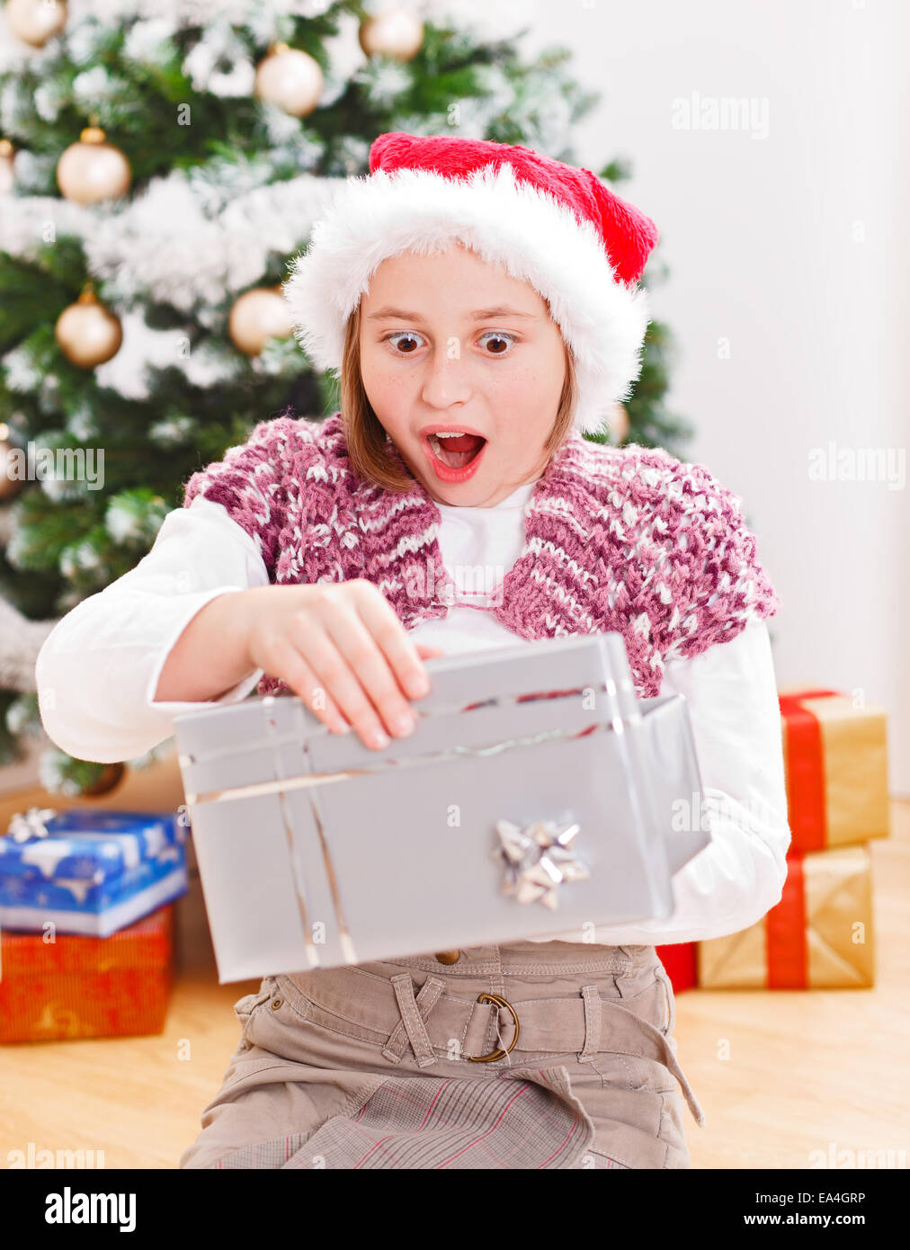 Girl opening christmas best sale presents