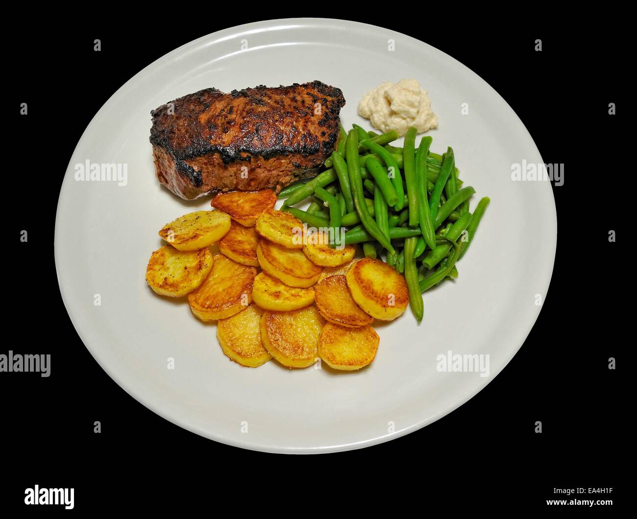 Steak mit Kartoffeln und Bohnen Stock Photo