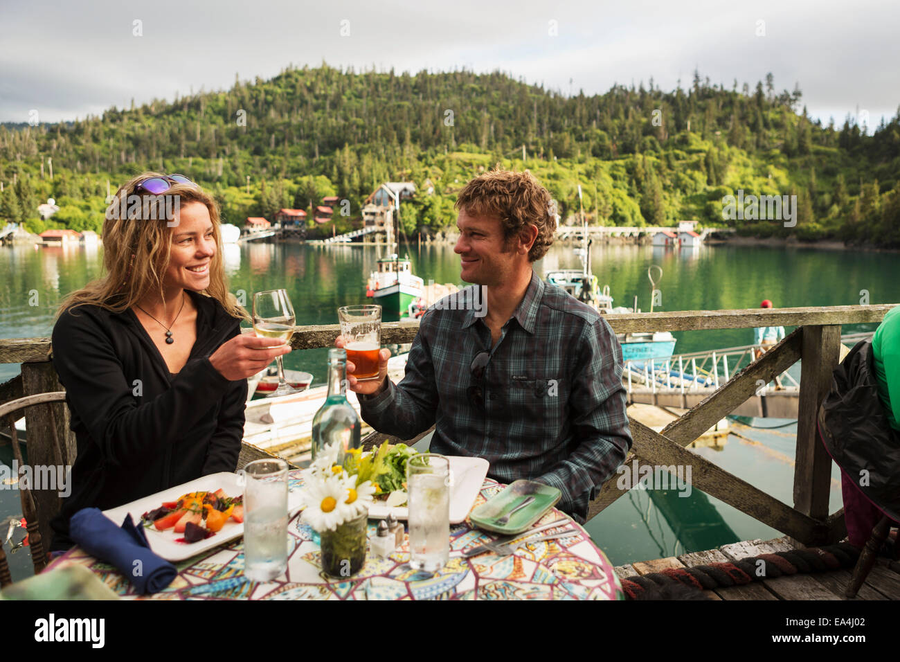 A couple in their 30's enjoys dinner at the Saltry Restaurant in