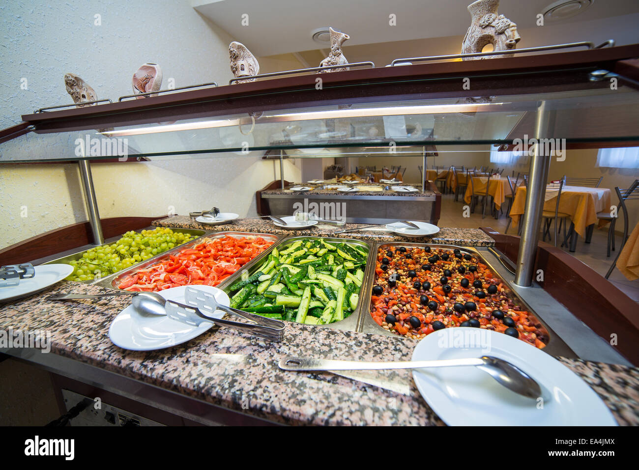 Restaurant buffet with the trays with salads at the counter Stock Photo