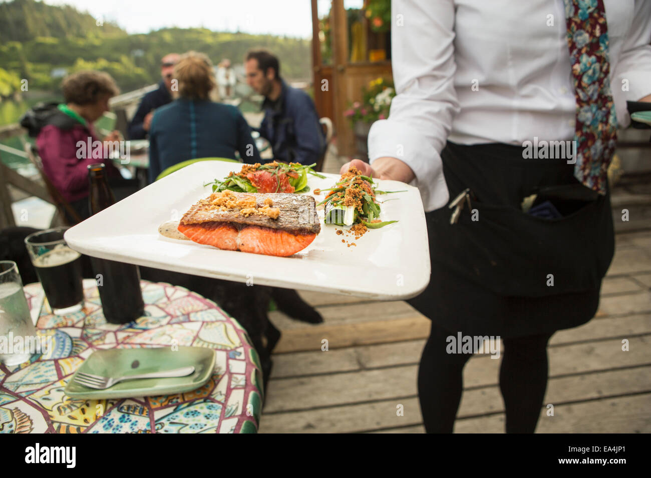 Waitress serves fresh locally caught Sockeye Salmon at The Saltry