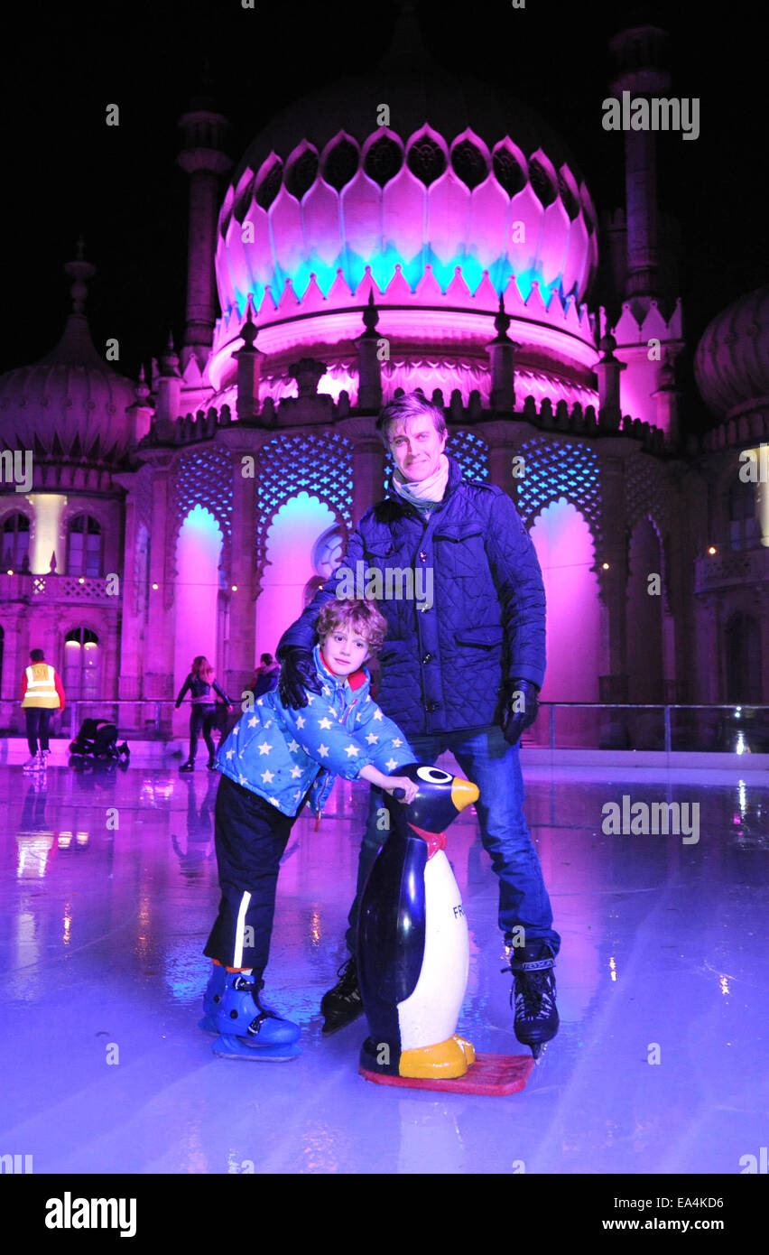 Brighton, UK. 6th November, 2014. Members of the public James Ellis Brown and son Lucas on the Royal Pavilion Ice Rink this evening at the VIP launch of the rinks 5th birthday The ice rink then remains open to the public over the Christmas and Winter season  Credit:  Simon Dack/Alamy Live News Stock Photo