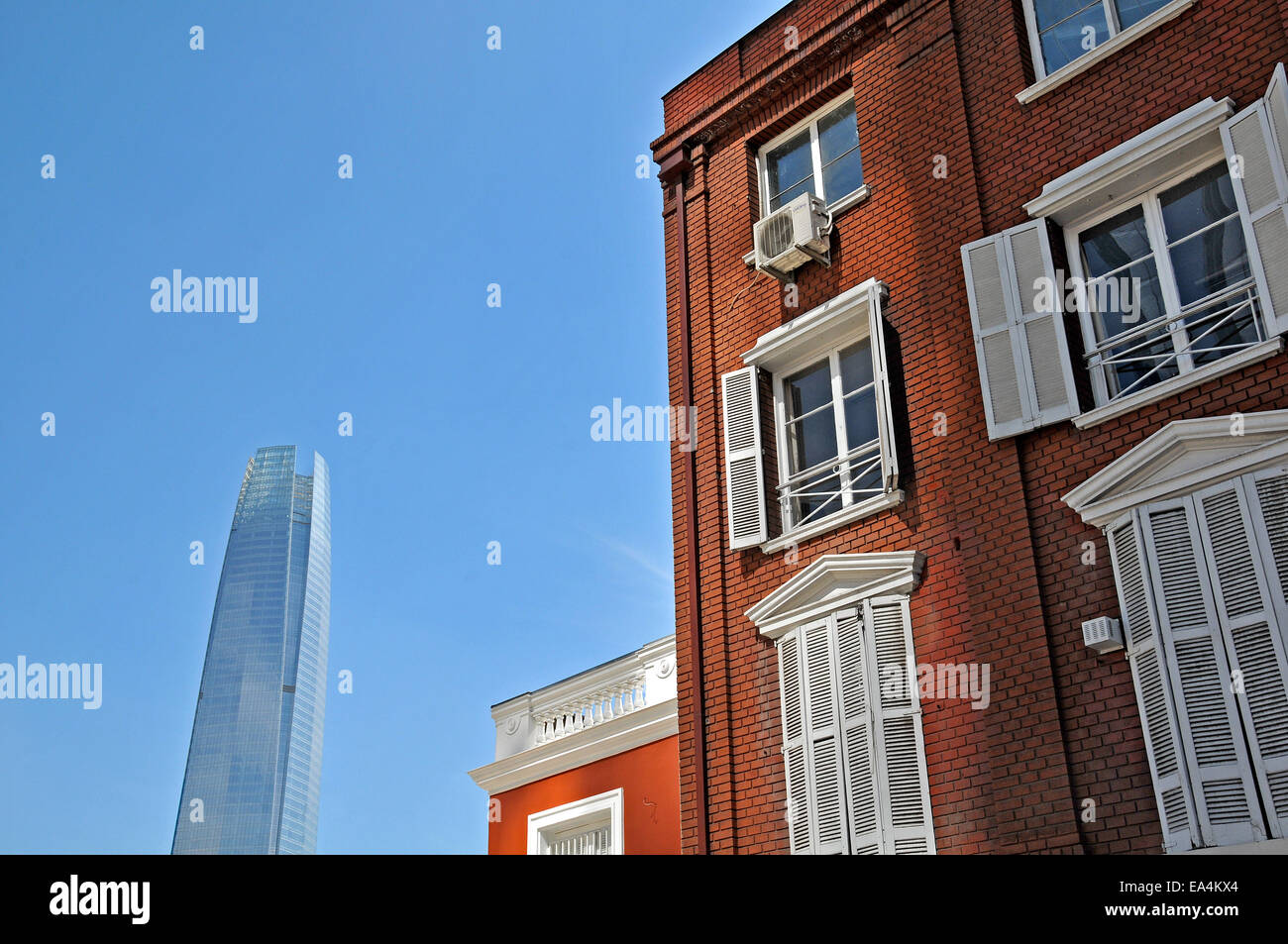 futuristic tower and ancient house Santiago Chile Stock Photo