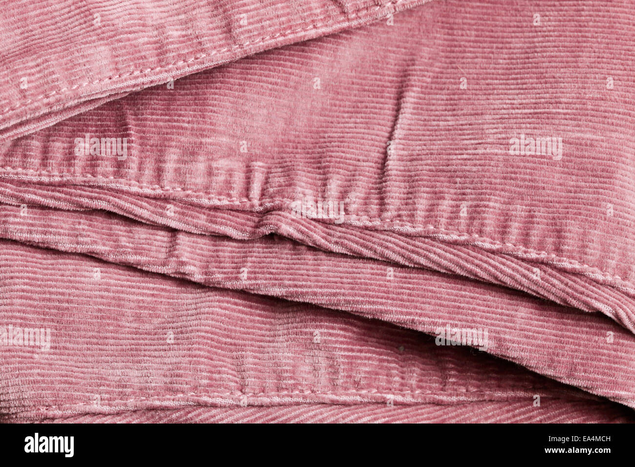 Close up of the seam on pink corduroy trousers Stock Photo