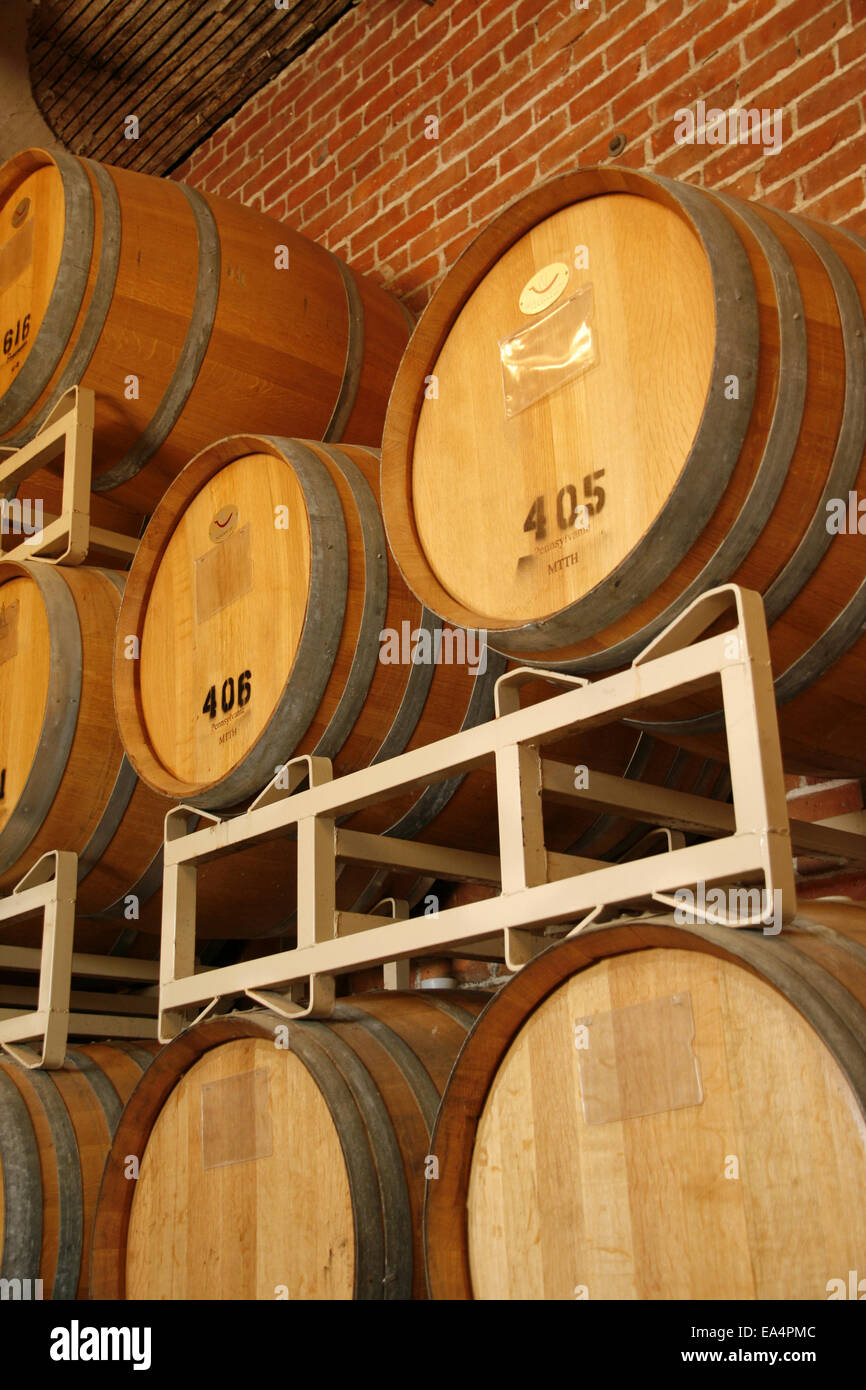 Wine barrels stacked in cellar area of winery Stock Photo Alamy
