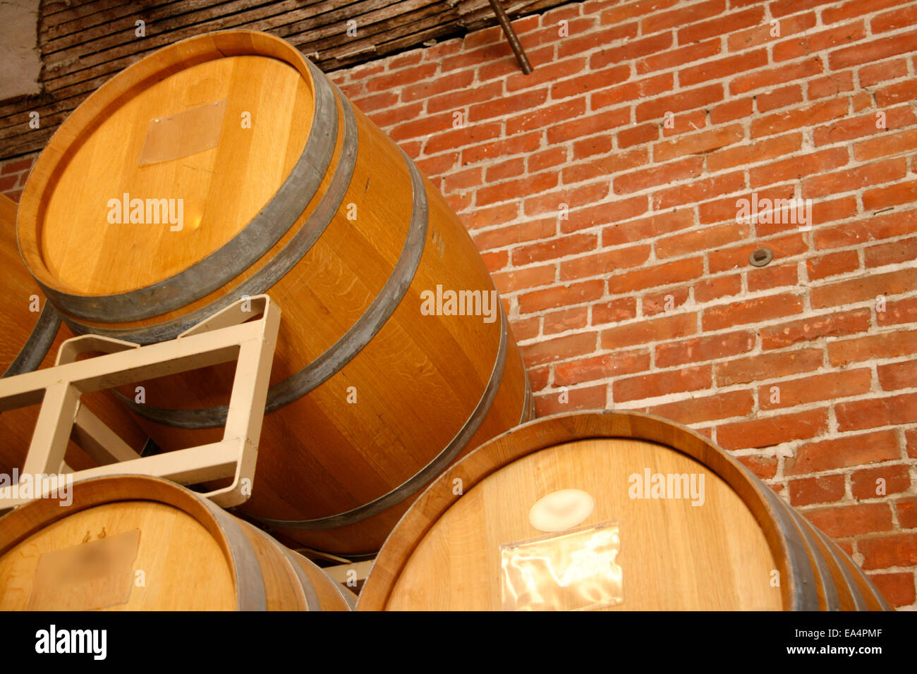 Wine barrels stacked in cellar area of winery Stock Photo Alamy