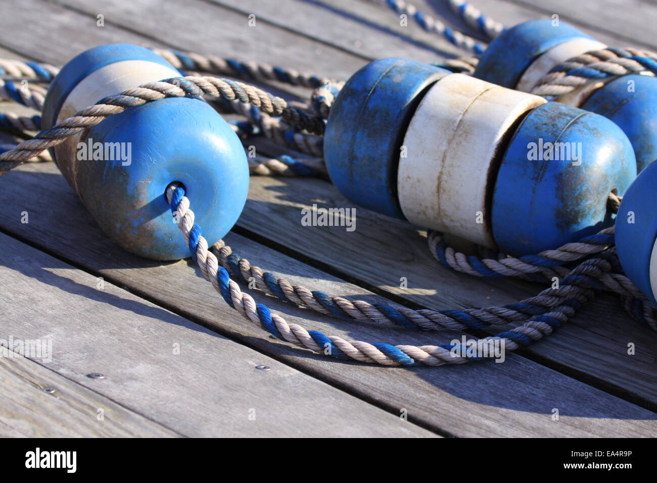 Nautical scene with blue buoys on a rope Stock Photo