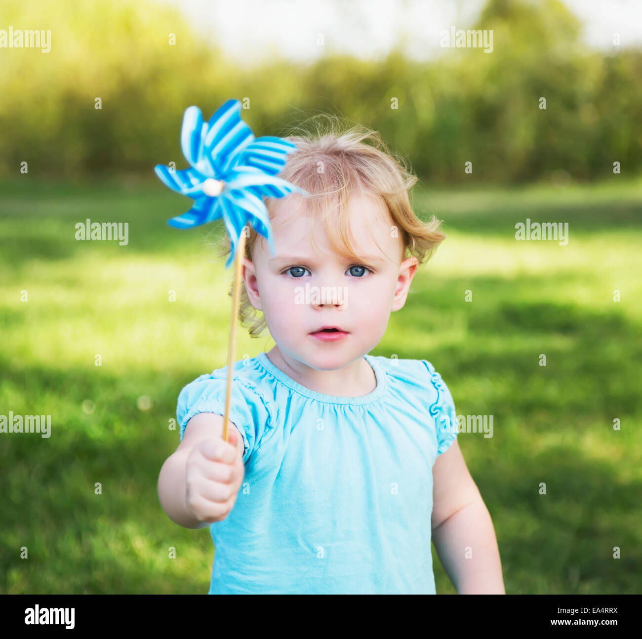 Young girl with pinwheel in a park; Edmonton, Alberta, Canada Stock ...