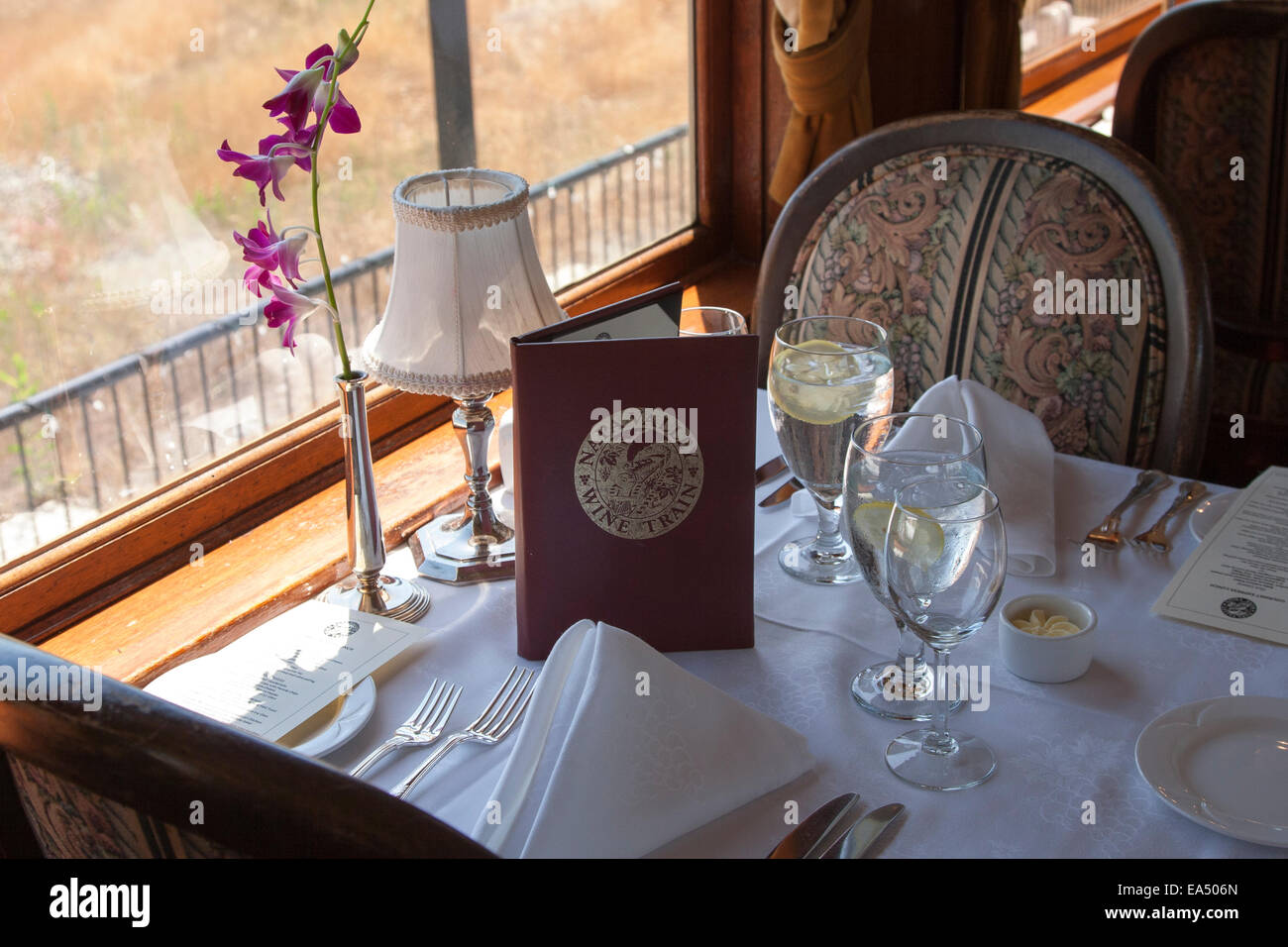 Table setting in a dining car aboard the Napa Valley Wine train in California. Stock Photo