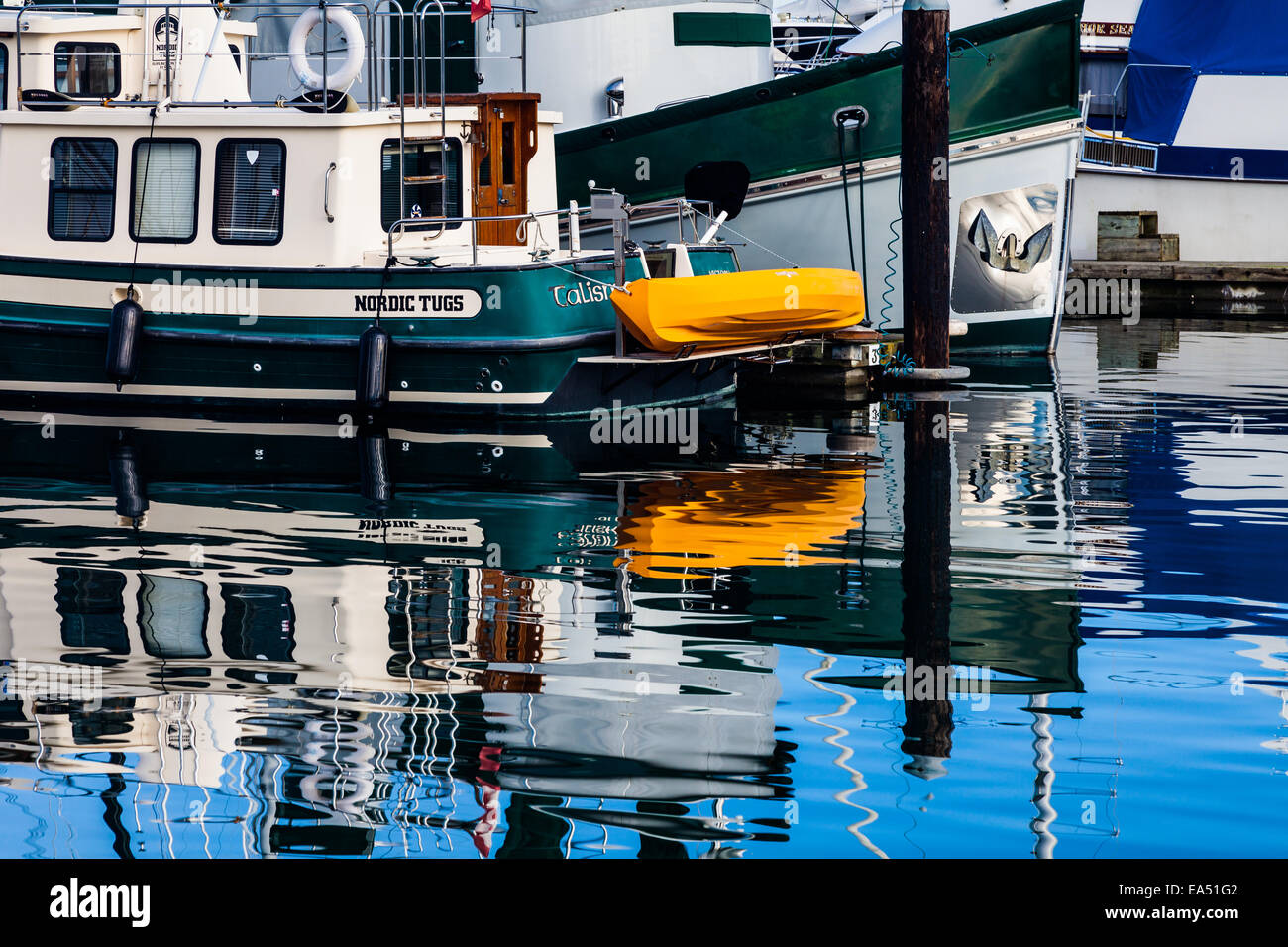 Bright reflections on calm water in a Sidney marina, British Columbia Stock Photo