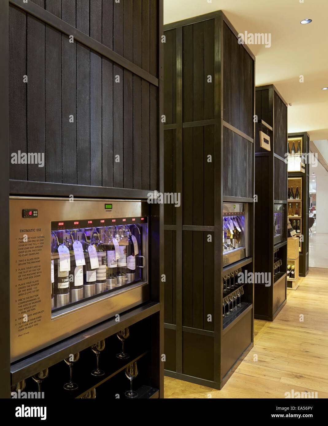 Selfridges Wine Shop, London, United Kingdom. Architect: Campaign Design, 2014. Wine display shelving made of burnt oak cladding Stock Photo