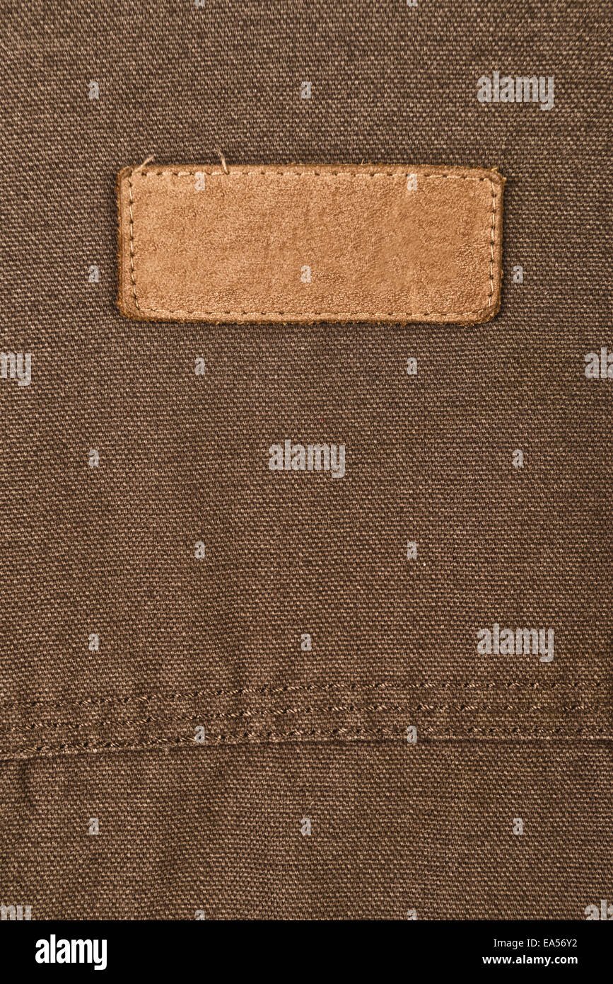 Small Size Clothes Label On Beige Textile Background Stock Photo