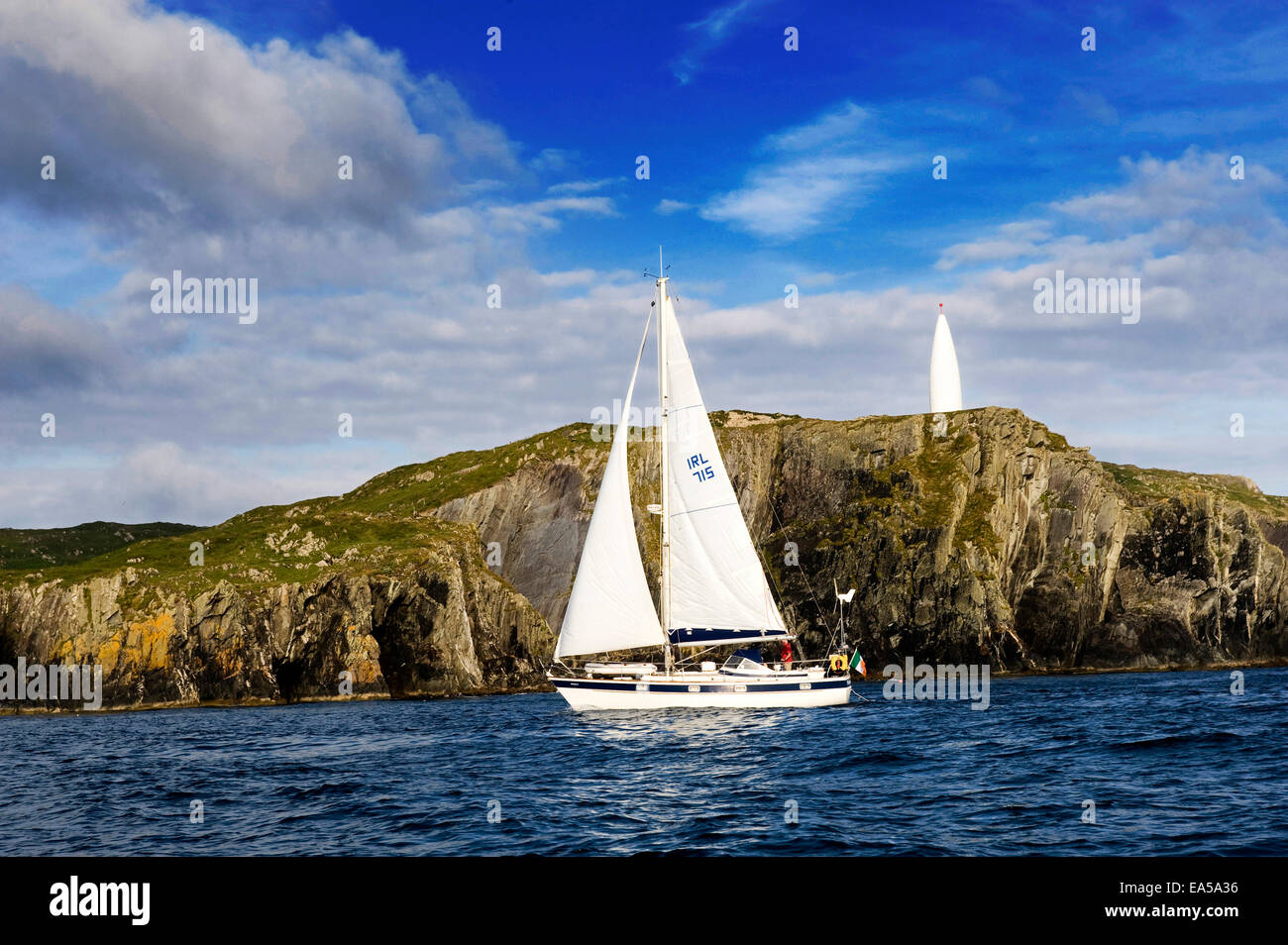 Sailing boat sails into Baltimore Harbour, Co. Cork, Ireland Stock Photo